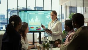 Group of business associates discussing RBA cash rate cut may 2025