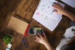 woman calculating RBA cash rate cut may 2025