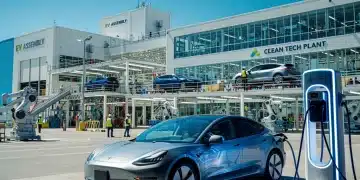 Electric vehicle charging at a station, symbolizing federal emissions standards impact on US auto industry